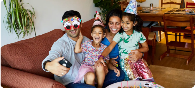 Family taking a photo at a birthday party